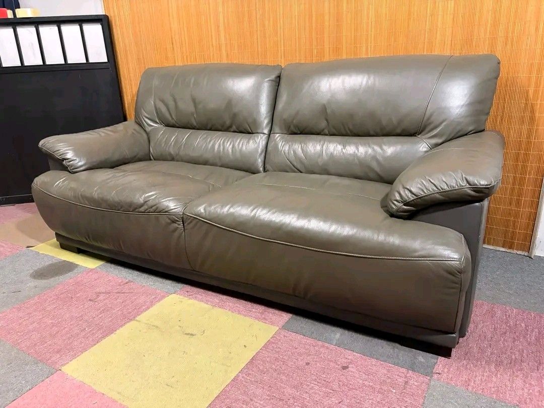 Grey Leather 2-Seater Sofa (Category: Sofas) located in Manila. Submitted by eloizavill76462 (Listing ID 1444129216, Image 1). Description: Modern 3-Seater Leather Sofa BIG & BULKY!!! SOFT & COMFY!!! THICK GENUINE LEATHER!!! 77L x 38W x 16H seat height inches Sandalan height 35 inches In good condition.