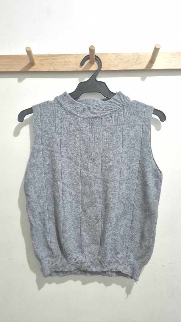 Grey Ribbed Knit Mock Neck Sweater Vest (Category: Sleeveless) located in Makati City. Submitted by chukothriftshop (Listing ID 1444200151, Image 1). Description: - Grey sweater vest - Ribbed knit texture - Sleeveless design - Ideal for layering - Bought from BKK Market.