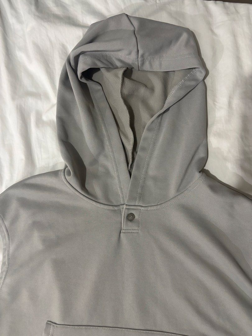 Grey Sleeveless Hoodie with Pocket and Drawstring (Category: Coats, Jackets and Outerwear) located in Manila. Submitted by thriftgodesa (Listing ID 1444276283, Image 2). Description: - Grey sleeveless hoodie - Features a front pocket - Drawstring at the hem for adjustable fit - Button closure at the neck - Ideal for layering or casual outfits - Simple and versatile design.