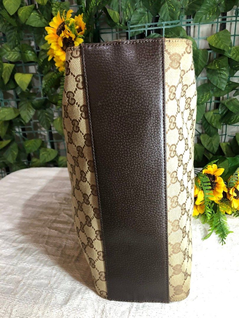 Gucci GG Canvas Tote Bag (Category: Luxury Bags & Wallets) located in Davao. Submitted by 4mscllection (Listing ID 1444176716, Image 3). Description: - Authentic Gucci tote bag - Classic GG canvas with leather trim - Spacious interior with zippered pocket - Dark brown leather handles and accents - Great for everyday use.