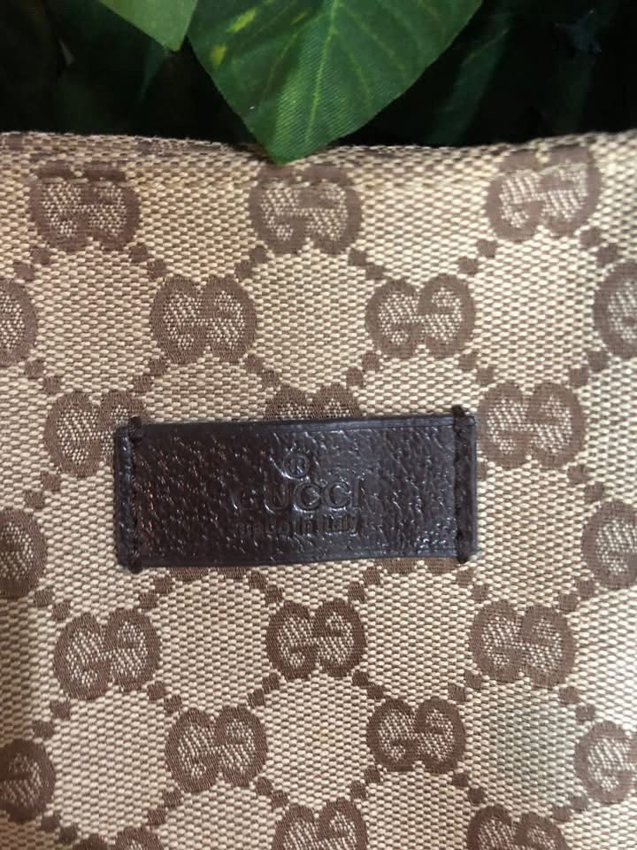 Gucci GG Canvas Tote Bag (Category: Luxury Bags & Wallets) located in Davao. Submitted by 4mscllection (Listing ID 1444176716, Image 2). Description: - Authentic Gucci tote bag - Classic GG canvas with leather trim - Spacious interior with zippered pocket - Dark brown leather handles and accents - Great for everyday use.