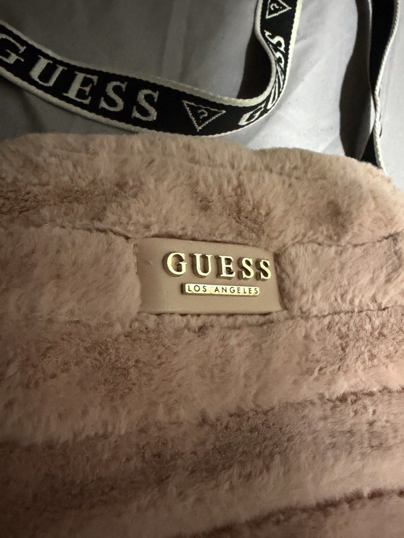 Guess shoulder bag (Category: Cross-body Bags) located in Manila. Submitted by declutterrrrrrrph (Listing ID 1444257480, Image 2). Description: With issue check photos.