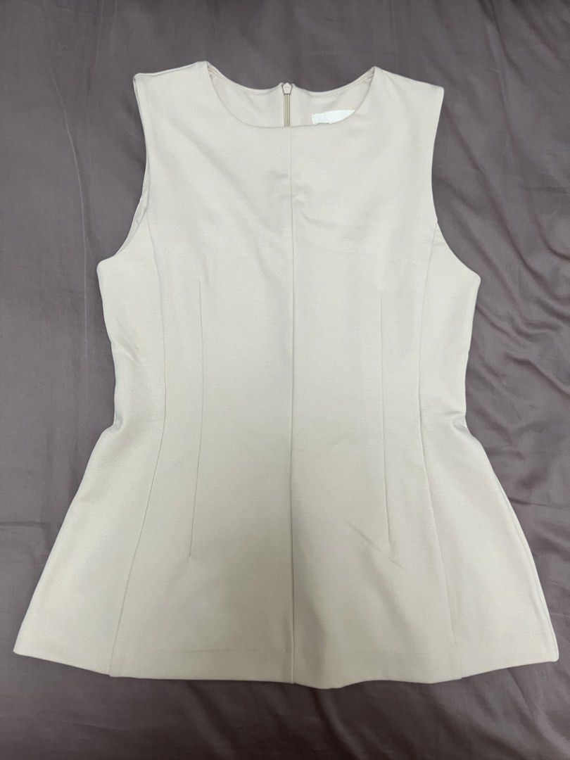 H&m sleeveless vest top (Category: Shirts) located in Manila. Submitted by ttll.lyn (Listing ID 1444245273, Image 1). Description: Never worn, rfs: too big, good condition, shipping not included .