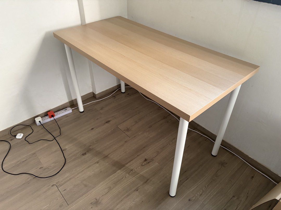 Ikea study table (Category: Tables & Sets) located in Singapore. Submitted by arlazd (Listing ID 1444198721, Image 1). Description: - Simple and sturdy desk - Light wood tabletop - Clean white metal legs - Ideal for home office or study space - Easy to assemble and move - Dimensions: Approx. 120cm x 60cm - Will dismantle when dealing -Able to deliver to your place with $5 fee.
