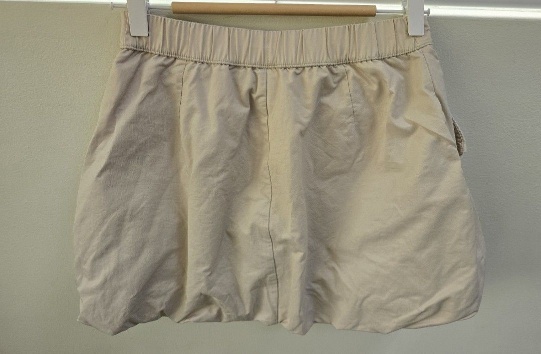 Just Kids Beige Cargo Bubble Skirt with Multiple Pockets (Category: Babies & Kids Fashion) located in Quezon City. Submitted by bringjoy (Listing ID 1444196468, Image 2). Description: - Cute beige cargo skirt - Multiple pockets on front and sides - Elastic waistband at the back for comfort - Zipper and button closure - Perfect for casual outfits, great for mix n match OOTDs - Waist measures approximately 14 inches across. with inner shorts.