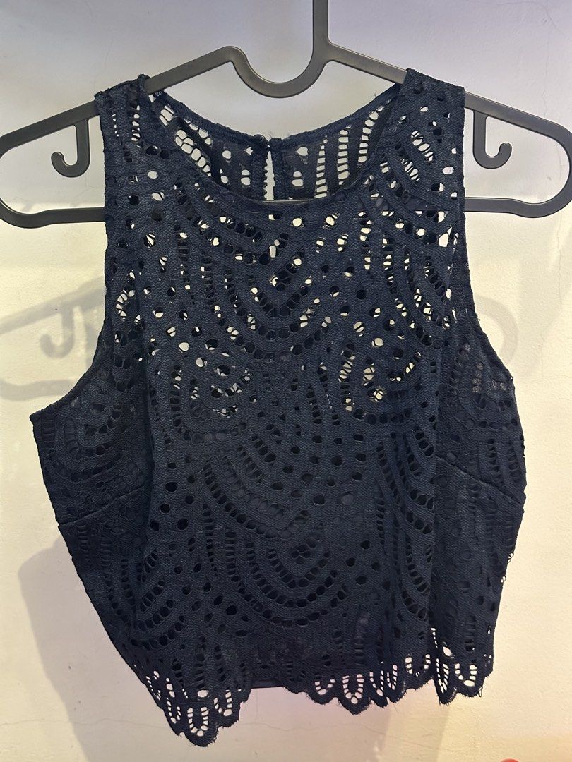 Karimadon Navy Blue Lace Crop Top (Category: Others Tops) located in Muntinlupa City. Submitted by zanne426 (Listing ID 1444180920, Image 1). Description: - Navy blue lace crop top from Karimadon - Sleeveless design - Round neckline - Unique all-over cut-out pattern - Scalloped hemline - Perfect for dressing up or down - Pairs well with high-waisted skirts or pants Size sml-med.