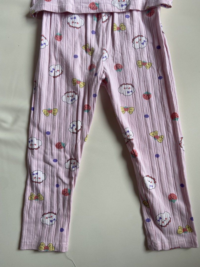 Kids Pink Cloud Strawberry Pajama Set (Category: Babies & Kids Fashion) located in Quezon City. Submitted by grmvi (Listing ID 1444183581, Image 3). Description: - Adorable pink pajama set for kids - Features a ribbed texture - Fun print: clouds, strawberries, and bows - Long sleeves and long pants - Perfect for sleeping and lounging - Sweet and comfortable design.
