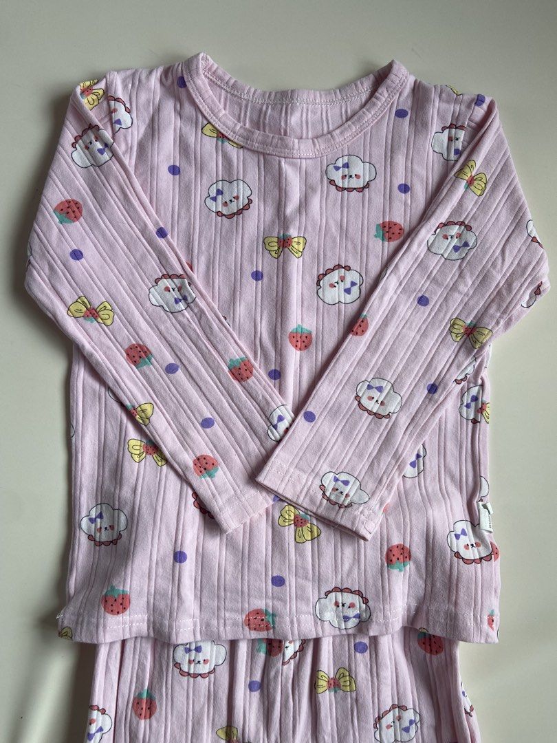 Kids Pink Cloud Strawberry Pajama Set (Category: Babies & Kids Fashion) located in Quezon City. Submitted by grmvi (Listing ID 1444183581, Image 2). Description: - Adorable pink pajama set for kids - Features a ribbed texture - Fun print: clouds, strawberries, and bows - Long sleeves and long pants - Perfect for sleeping and lounging - Sweet and comfortable design.