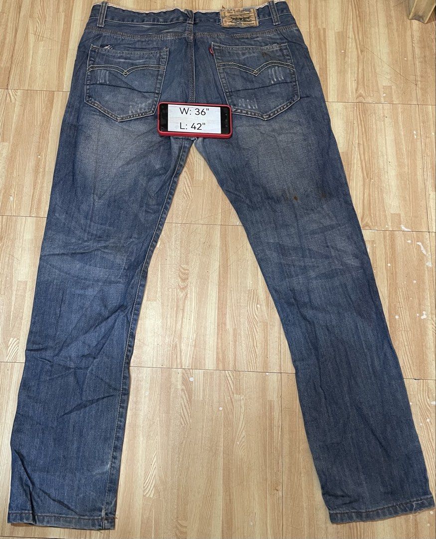 Levi's Strauss Jeans W36 L42 (Category: Jeans) located in Caloocan City. Submitted by jetcon (Listing ID 1444171696, Image 2). Description: - Brand: Levi's Strauss - Color: Classic Blue Denim - Size: Waist 36 inches, Length 42 inches - Closure: Button and zip front - Features: Signature back pocket stitching - Condition: Minor marks and wear consistent with use - Rust stain on right leg (see pic) hence selling low Gcash payment 1st + SF SF rates: