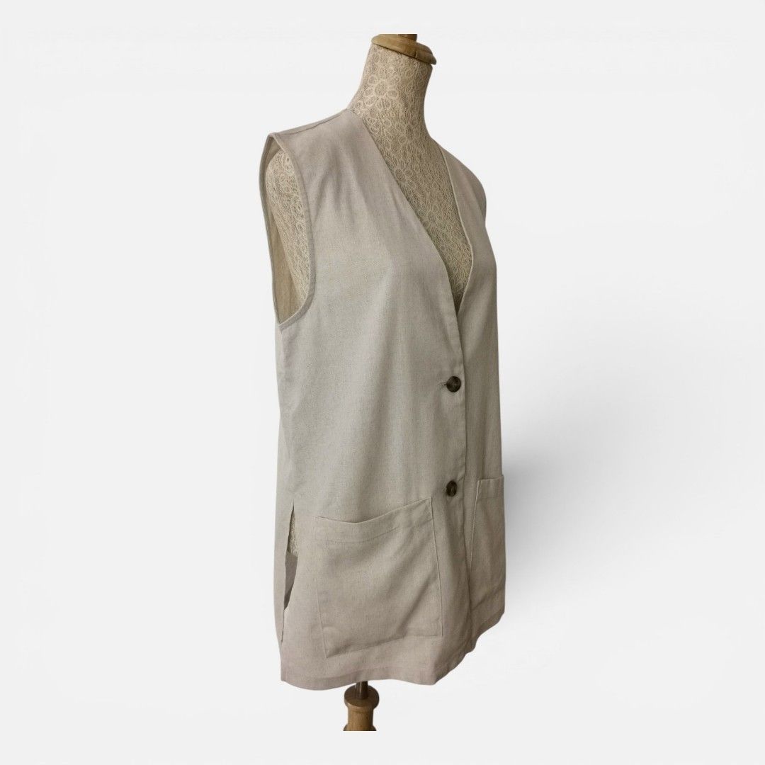 Light Beige V-Neck Sleeveless Vest with Buttons (Category: Sleeveless) located in Mandaue City. Submitted by stylefigjam (Listing ID 1444227439, Image 2). Description: - Simple beige vest - V-neckline - Two-button closure - Two front pockets - Sleeveless - Ideal for layering with shirts or dresses - freesize, can fit up to L body frames.