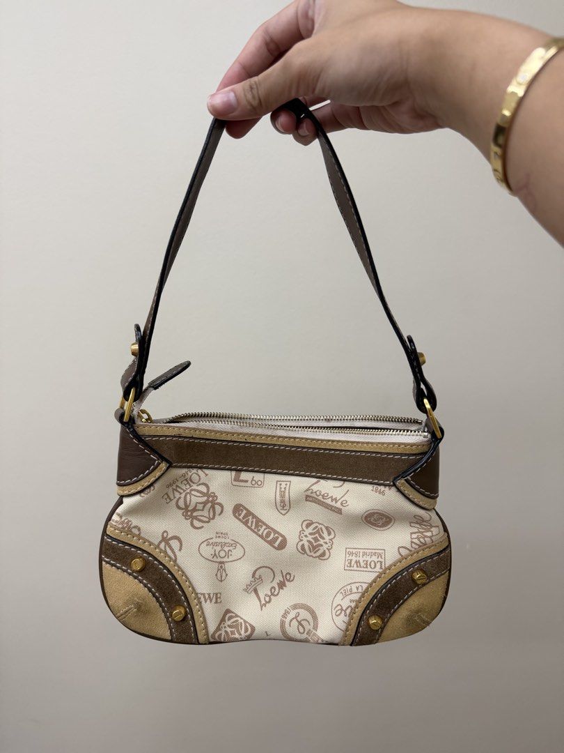 Loewe Monogram Pochette (Category: Luxury Bags & Wallets) located in Manila. Submitted by tashvintagefinds (Listing ID 1444273605, Image 1). Description: - Authentic Loewe shoulder bag - Has signs of usage - Includes original dustbag - Nego.