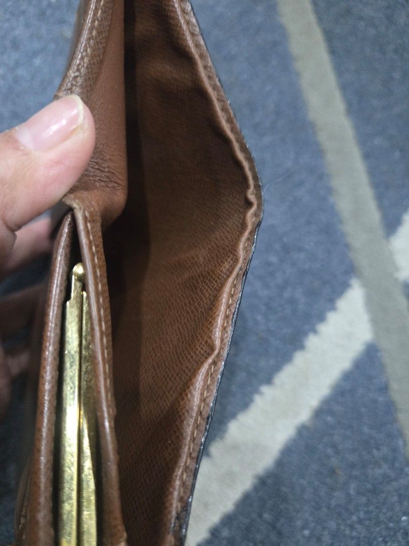 Louis Vuitton Monogram Canvas Bifold Wallet (Category: Luxury Bags & Wallets) located in Las Pinas. Submitted by peloveditems (Listing ID 1444256121, Image 3). Description: - Classic Louis Vuitton monogram wallet - Bifold style with secure snap closure - Interior includes card slots and a coin pocket - Elegant gold-tone hardware - Fully functional and still a stylish accessory.