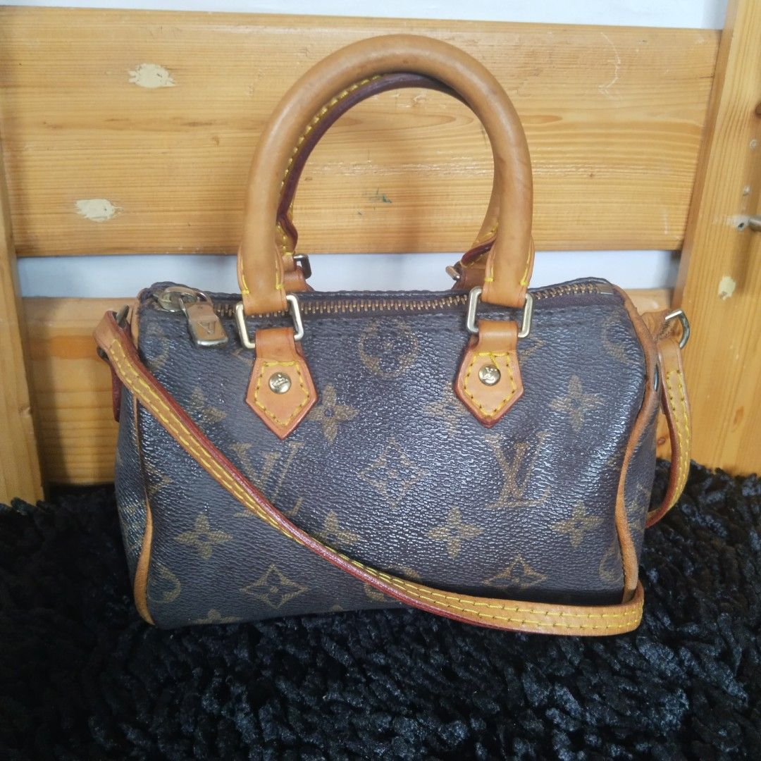Louis Vuitton Speedy Nano Monogram Canvas Handbag (Category: Luxury Bags & Wallets) located in Lubao. Submitted by dione_closet503 (Listing ID 1444175713, Image 1). Description: - Classic Louis Vuitton Speedy Nano bag - Iconic Monogram canvas with Vachetta leather trim - Top handles and detachable shoulder strap for versatile carrying - Secure zipper closure - Compact and cute, ideal for your essentials - Shows some signs of wear on leather and c
