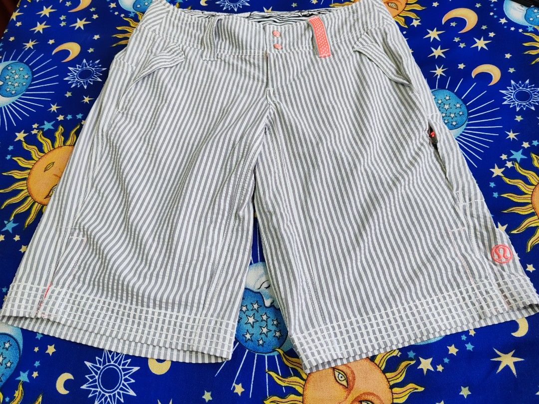 Lululemon Athletica Striped Athletic Shorts Size 4 (Category: Activewear) located in Manila. Submitted by mcrhown (Listing ID 1444145352, Image 1). Description: - Lululemon Athletica grey and white striped athletic shorts - Size: 4 - Color accent: Coral pink detail - Closure: Button - Material: Nylon and Lycra blend - Ideal for: Workouts or casual wear W28 L18.