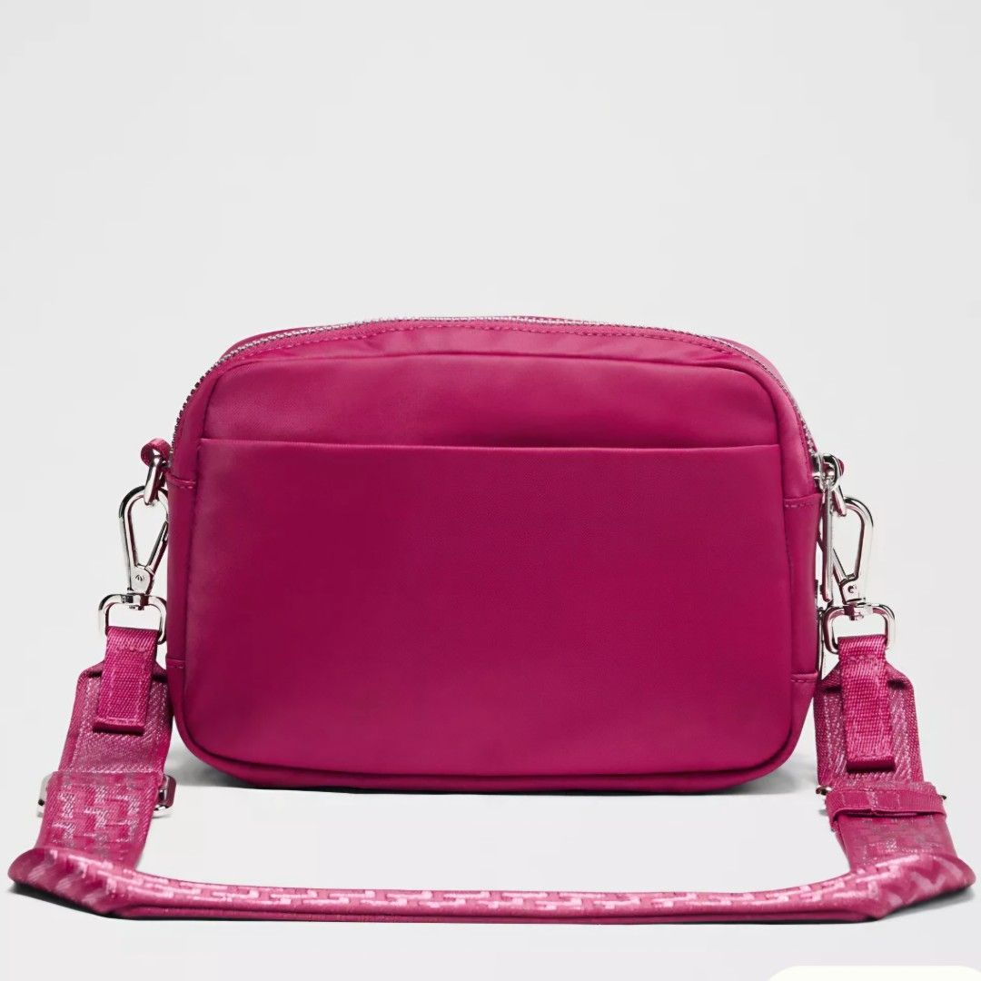 Lululemon Everywhere Crossbody Bag Magenta (Category: Cross-body Bags) located in Bulacan. Submitted by bnbig (Listing ID 1444291710, Image 3). Description: - So pretty Lululemon Crossbody Bag - Vibrant magenta color - Multiple zippered compartments for organization - Adjustable strap with textured pattern - Ideal for everyday use, travel, or workouts Guaranteed Authentic 💯 Reminders: 1. Actual color may differs because of the lightning when the
