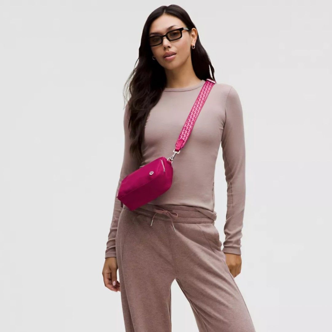 Lululemon Everywhere Crossbody Bag Magenta (Category: Cross-body Bags) located in Bulacan. Submitted by bnbig (Listing ID 1444291710, Image 2). Description: - So pretty Lululemon Crossbody Bag - Vibrant magenta color - Multiple zippered compartments for organization - Adjustable strap with textured pattern - Ideal for everyday use, travel, or workouts Guaranteed Authentic 💯 Reminders: 1. Actual color may differs because of the lightning when the