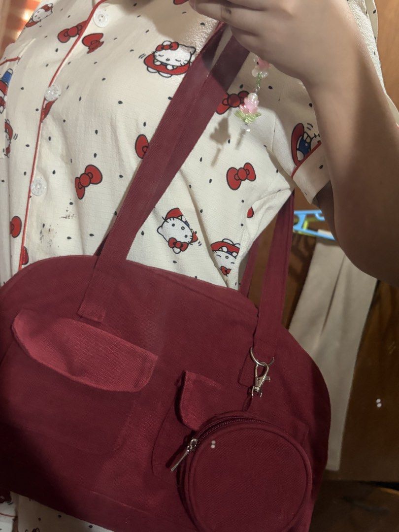Maroon Red Canvas Bag with Small Pouch (Category: Shoulder Bags) located in Manila. Submitted by lovedbybea.c (Listing ID 1444189309, Image 2). Description: RED CANVAS BAG !! FIXED PRICE !! Buyer will accommodate shipping!! !! NO ISSUES !! Mop: - Gcash - Paymaya Mod: - Lalamove - Grabe.