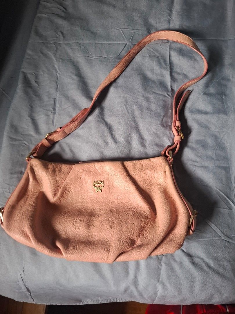 MCM Embossed Monogram Leather Slouched Hobo (Category: Luxury Bags & Wallets) located in Manila. Submitted by yelenarari (Listing ID 1444118823, Image 1). Description: Authentic MCM Embossed Monogram Leather Slouched Hobo good condition rfs: need funds.