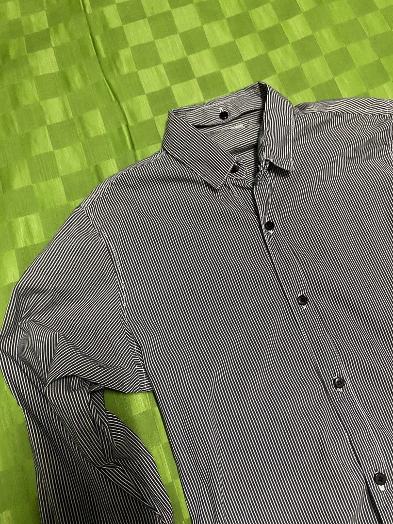 Men's Striped Long Sleeve Button-Up Shirt (Category: Tshirts & Polo Shirts ) located in Quezon City. Submitted by virginsuicide333 (Listing ID 1444226622, Image 3). Description: - Classic black and white striped long sleeve shirt - Button-up front with black buttons - Roll-up sleeve tabs for adjustable length - Removable collar - Fits S-M.