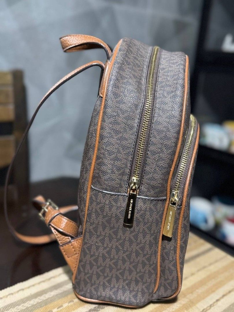 Michael Kors Signature Monogram Backpack (Category: Luxury Bags & Wallets) located in Cavite. Submitted by _lunabanana (Listing ID 1444261854, Image 3). Description: Authentic Michael Kors Abbey Medium Backpack (Preloved) Looking for a stylish and durable everyday bag? Selling my original MK Abbey Backpack in Signature Brown monogram. 🤎 Super ganda at classy sa personal! Smooth zippers, malinis ang loob at labas. Minimal signs of use but overall