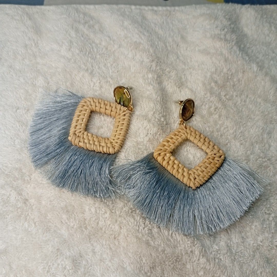 MOTF Woven Square Tassel Earrings (Category: Earrings) located in San Fernando. Submitted by kristhriftshop13 (Listing ID 1444300876, Image 1). Description: - Light blue tassel earrings - Woven square detail - Gold-tone stud - Includes original MOTF box - Adds a boho vibe to any outfit - Lightweight and comfortable.