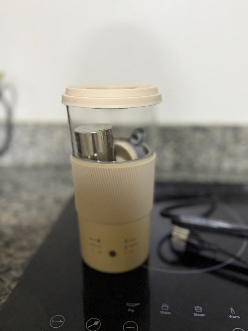 Multipurpose Electric Milk Foam Frother Maker (Category: Coffee & Tea Tableware) located in Quezon City. Submitted by lexieshuu162243 (Listing ID 1444135516, Image 2). Description: - Portable electric mug - Heats and stirs your drinks - Perfect for coffee, tea, milk tea, and milk foam - Includes a cancel button - Comes with a power cord - Ideal for on-the-go convenience.