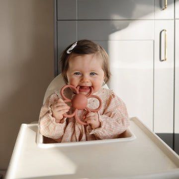 Mushie Silicone Daisy Rattle Flower Teether Rose Pink (Category: Soothers & Pacifiers) located in Bulacan. Submitted by tinparco (Listing ID 1444133073, Image 2). Description: 🩷Good as new 🩷Authentic Mushie product 🩷Gently used and thoroughly cleaned.🩷Made from soft, textured silicone. 🩷Easy for babies to grip. 🩷Soothes sore gums during teething. .