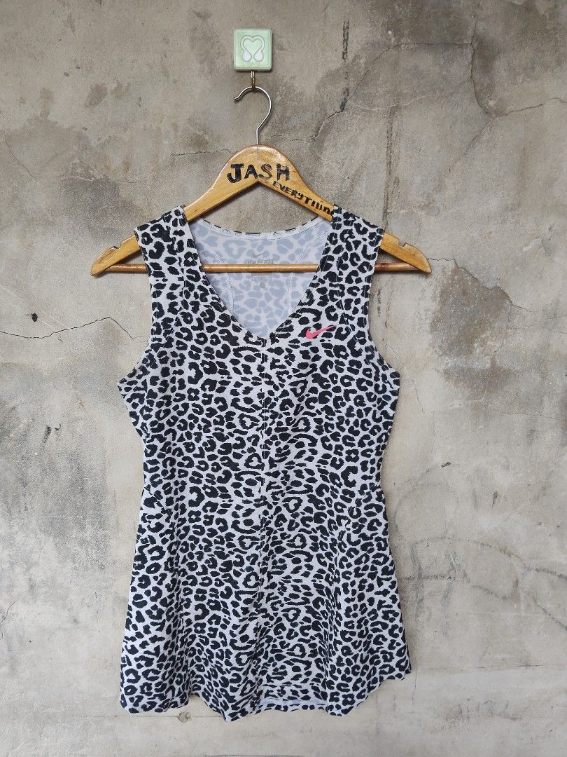 Nike Dri-Fit Leopard Print Tank Top (Category: Activewear) located in City of Isabela. Submitted by jasheverything (Listing ID 1444272173, Image 1). Description: - Nike Dri-Fit tank top - All-over leopard print design - Bright pink Nike logo on chest - Made in Cambodia - Ideal for workouts and casual wear Excellent Condition 750+SF.