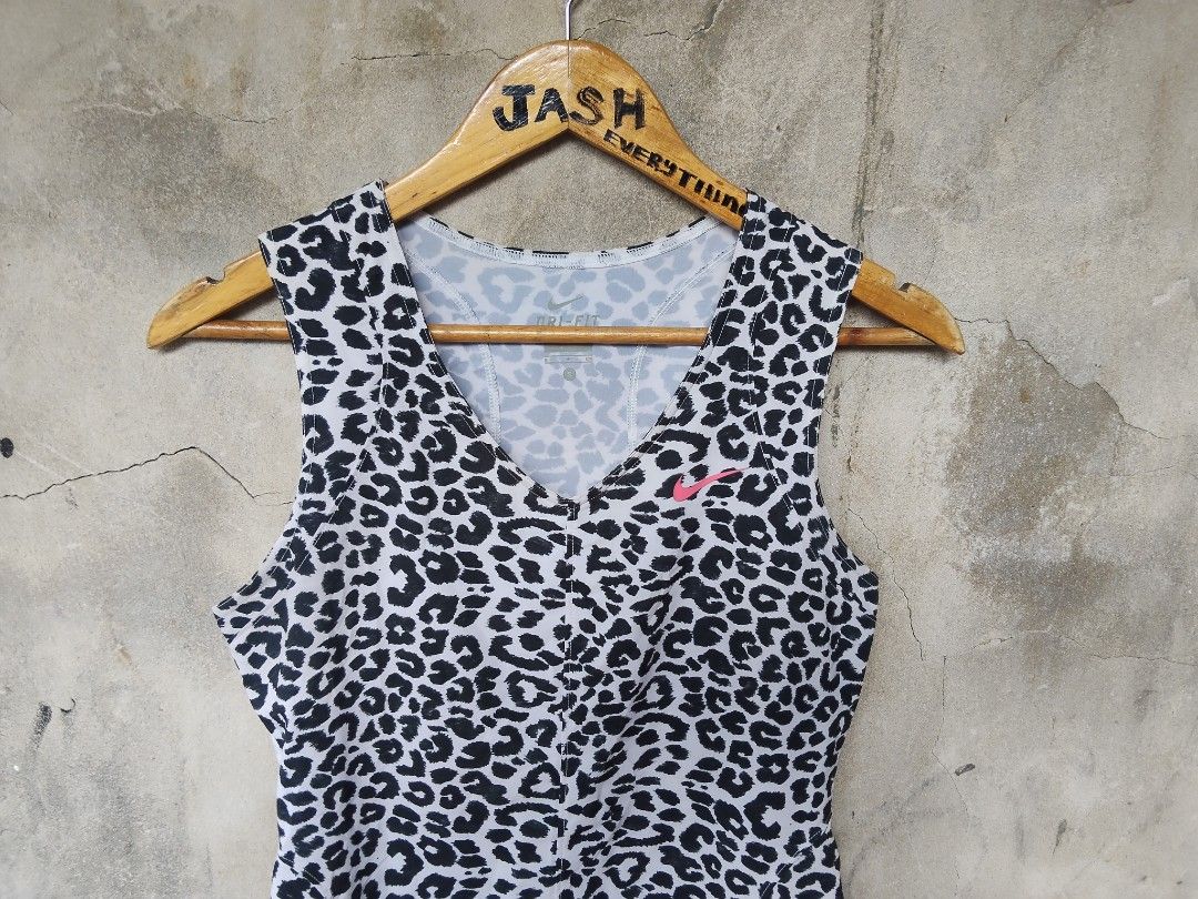 Nike Dri-Fit Leopard Print Tank Top (Category: Activewear) located in City of Isabela. Submitted by jasheverything (Listing ID 1444272173, Image 2). Description: - Nike Dri-Fit tank top - All-over leopard print design - Bright pink Nike logo on chest - Made in Cambodia - Ideal for workouts and casual wear Excellent Condition 750+SF.