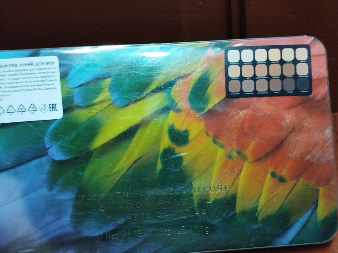 Overture Eyeshadow Palette - 16 Shades (Category: Makeup) located in Cabuyao City. Submitted by elaine.toqz (Listing ID 1444183482, Image 3). Description: - Overture Eyeshadow Palette - 16 vibrant shades - Features a unique parrot feather design on the case - Includes a helpful shade guide on top - Ideal for creating diverse makeup looks - A must-have for makeup enthusiasts - sealed.