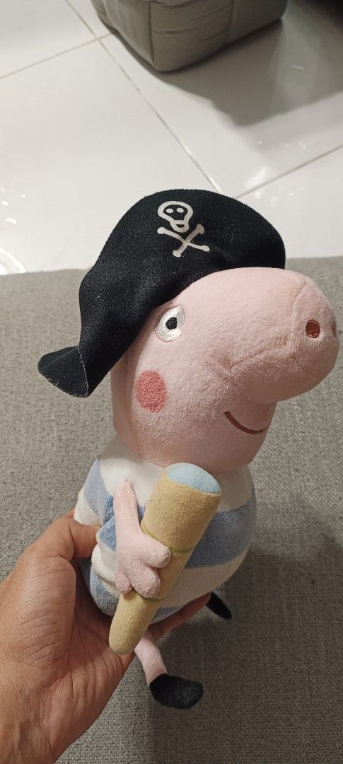 Peppa Pig Pirate Plush Toy with Eye Patch (Category: Plushies & Soft Toys) located in Manila. Submitted by deeclutter_hub (Listing ID 1444240371, Image 1). Description: - Adorable Peppa Pig plush toy dressed as a pirate. - Features a pirate hat with skull and crossbones. - Includes an eye patch for authentic pirate look. - Blue and white striped shirt. - Holding a yummy yellow ice cream cone. - A must-have for any Peppa Pig enthusiast!.