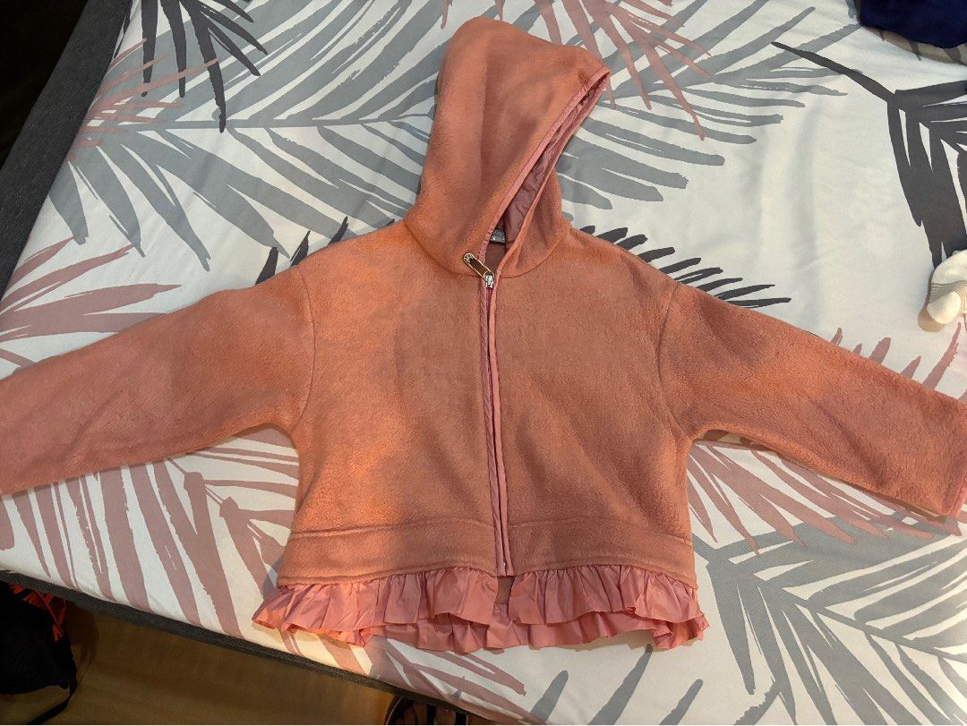 Pink Fleece Jacket with Ruffle Detail (Category: Coats, Jackets and Outerwear) located in Quezon City. Submitted by archer417 (Listing ID 1444196850, Image 1). Description: - Adorable pink fleece jacket for kids - Soft and cozy material - Features a convenient zipper closure - Sweet ruffled trim detail - Ideal for cooler weather - Easy to put on and take off.