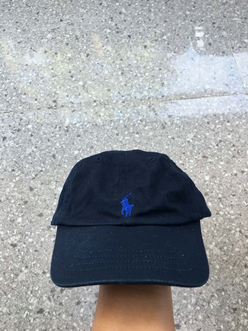 Polo Ralph Lauren Cap - White & Navy Blue (Category: Caps & Hats) located in General Santos City (Dadiangas). Submitted by mike1427 (Listing ID 1444112229, Image 2). Description: - Set of 2 Polo Ralph Lauren caps - Colors: 1 White with Navy Blue logo, 1 Navy Blue with Navy Blue logo - Features embroidered Polo logo on front - Navy cap has 'POLO' embroidery on back - Material: 100% Cotton - Size: Toddler - Aspack Ralph Lauren Caps for your kids - 