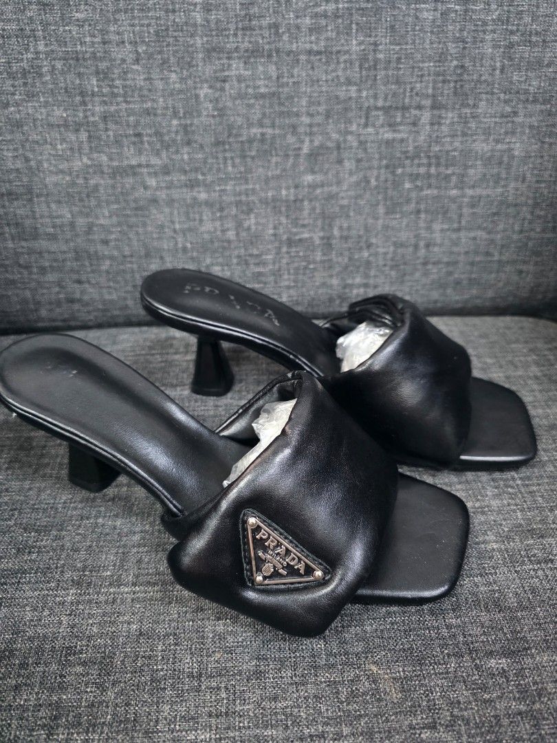 Prada Black Leather Padded Slides Sandals Size 36 (Category: Flats & Sandals) located in General Trias. Submitted by roselle2230 (Listing ID 1444277129, Image 3). Description: - Authentic Prada Slides - Size: 36 - Material: Padded leather straps - Design: Square toe - Heel Height: Approx. 2 inches - Origin: Made in Italy.