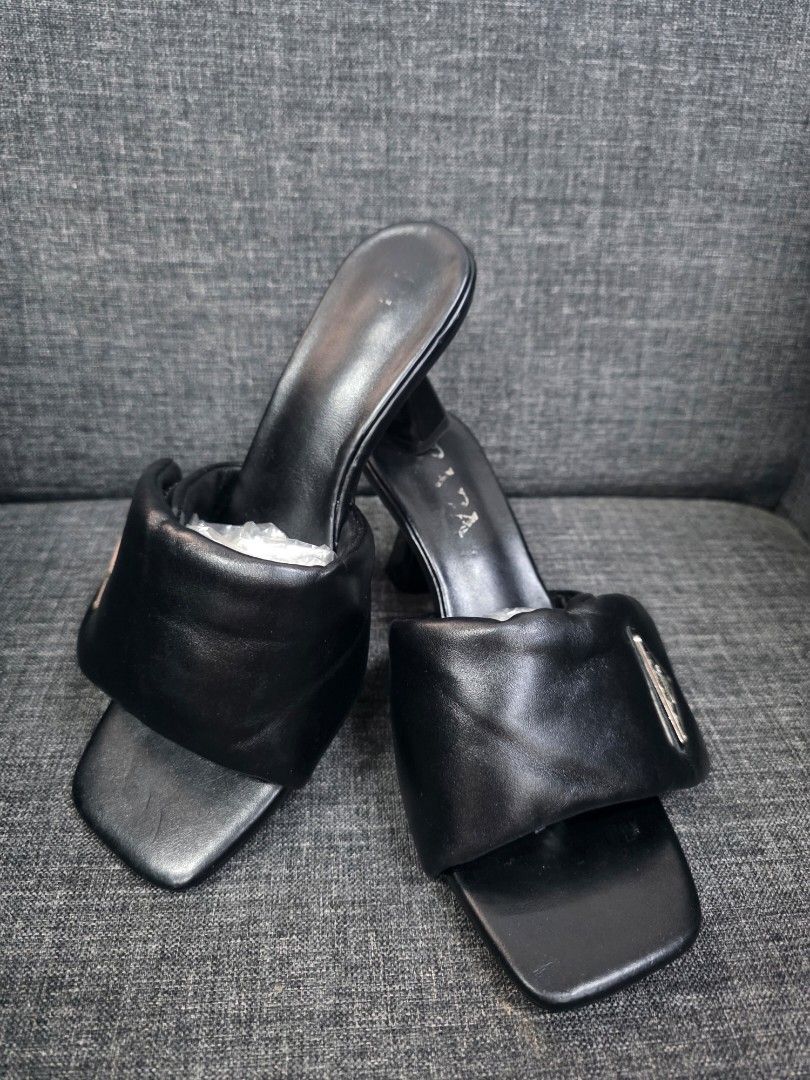 Prada Black Leather Padded Slides Sandals Size 36 (Category: Flats & Sandals) located in General Trias. Submitted by roselle2230 (Listing ID 1444277129, Image 2). Description: - Authentic Prada Slides - Size: 36 - Material: Padded leather straps - Design: Square toe - Heel Height: Approx. 2 inches - Origin: Made in Italy.