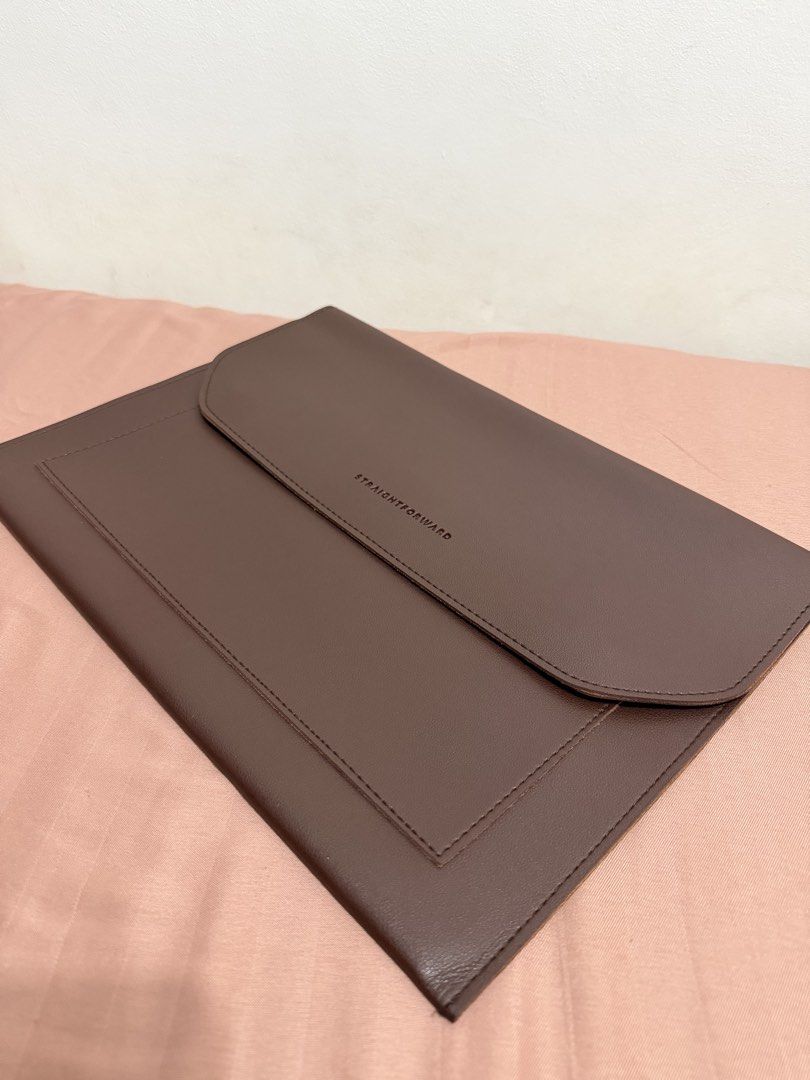 Preloved Straightforward Brown DVL Multi-pocket Laptop Sleeve (Category: Laptop Bags & Sleeves) located in Las Pinas. Submitted by kayjvr (Listing ID 1444135140, Image 1). Description: Vegan Leather Can fit a 15” Macbook Air. Can provide more pictures if requested..