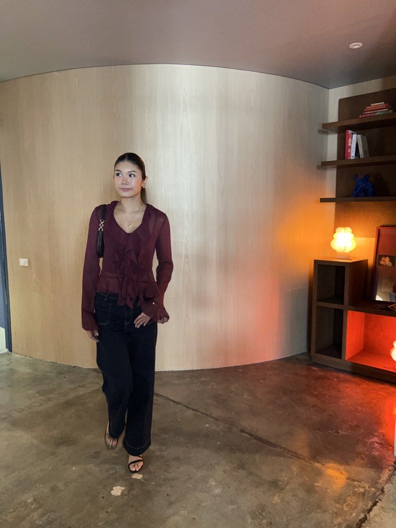 Sheer Ruffle Long Sleeve Blouse - Burgundy (Category: Blouses) located in Makati City. Submitted by isabelscloset (Listing ID 1444162076, Image 1). Description: - Burgundy sheer blouse - Long sleeves - Ruffled front detail - Tie detail - Perfect for dressing up or down - Pairs well with jeans or trousers - Comfortable and stylish.