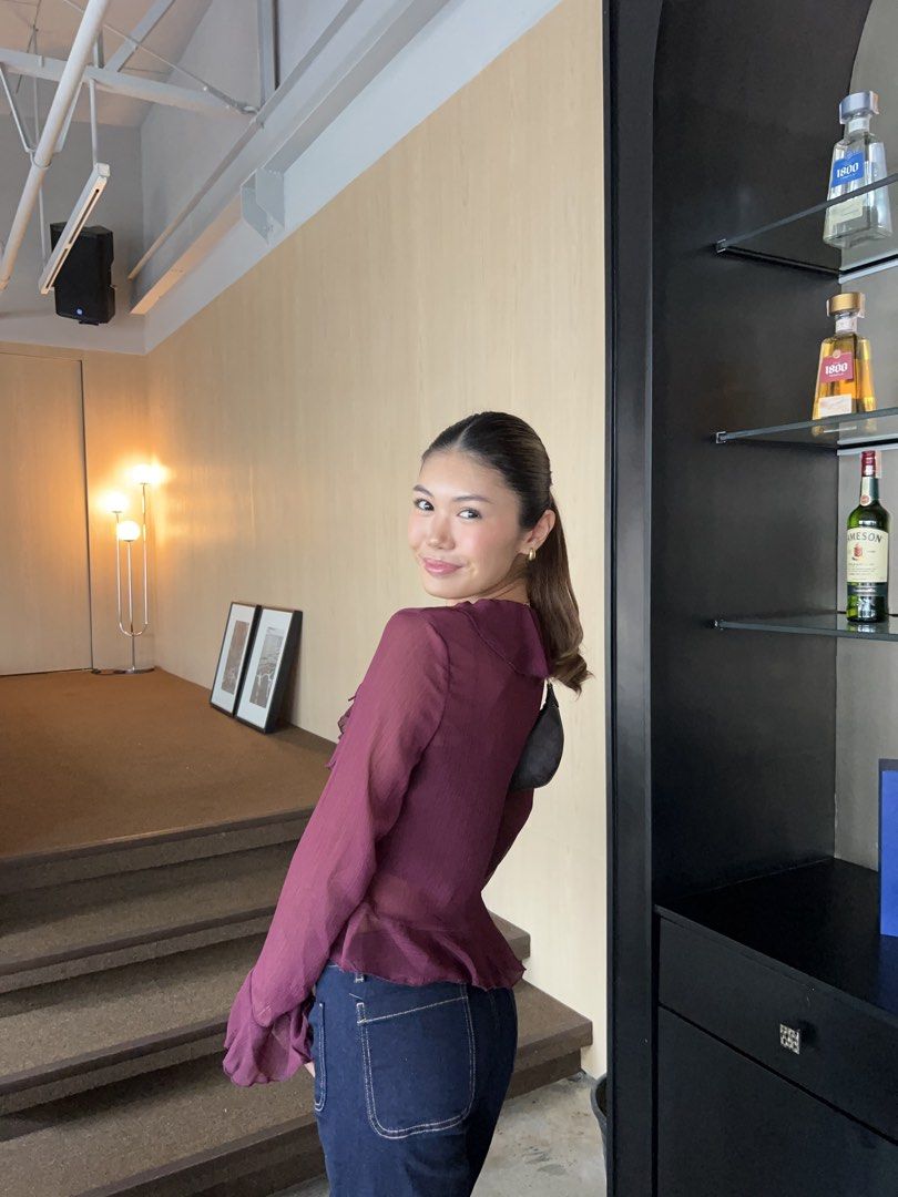 Sheer Ruffle Long Sleeve Blouse - Burgundy (Category: Blouses) located in Makati City. Submitted by isabelscloset (Listing ID 1444162076, Image 3). Description: - Burgundy sheer blouse - Long sleeves - Ruffled front detail - Tie detail - Perfect for dressing up or down - Pairs well with jeans or trousers - Comfortable and stylish.