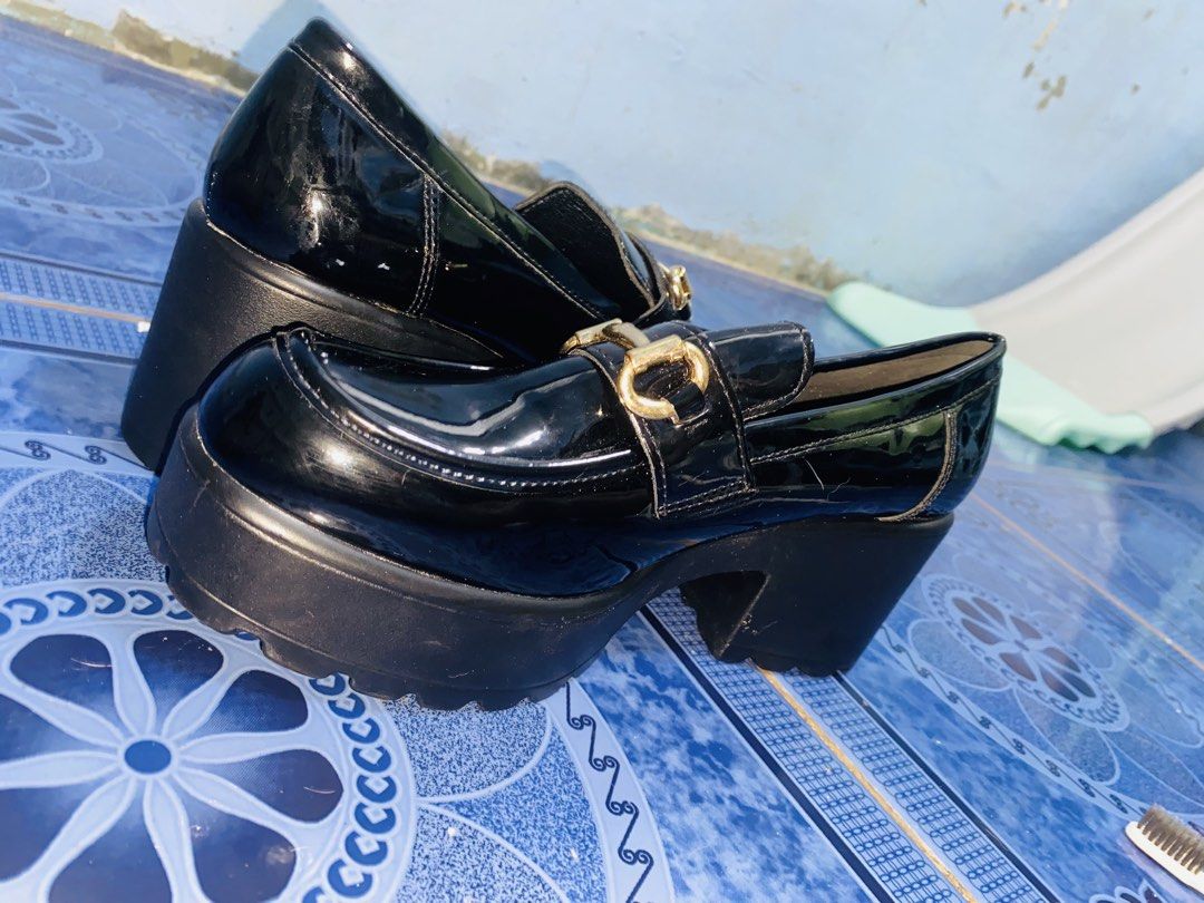 SHEIN Black Patent Chunky Platform Loafers (Category: Loafers) located in Manila. Submitted by swiftfish-afc9a7 (Listing ID 1444112897, Image 2). Description: - Black patent loafers - Chunky platform and heel - Gold buckle detail on the front - 'CUCOO' branded soles - Size 39 - Versatile for dressing up or down.
