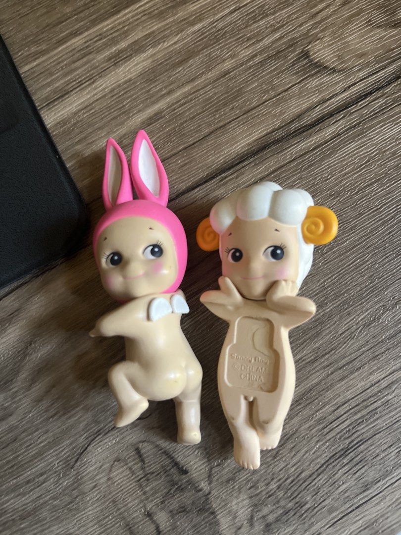 Sonny Angel Bunny and Sheep Figures (Category: Designer & Blind Box Toys) located in Tabaco. Submitted by nrnbngln (Listing ID 1444177647, Image 1). Description: - Adorable Sonny Angel Bunny figure with pink ears and pink hood. - Cute Sonny Angel Sheep figure with white wool and yellow horns. - Perfect for Sonny Angel collectors. - Adds a touch of charm as a desk accessory. - Grab these collectible toys today!.