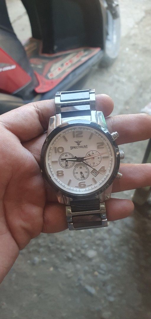 Spectra Chronograph Watch (Category: Men's Watches) located in Zamboanga. Submitted by sarahjaneatari (Listing ID 1444150175, Image 1). Description: - Spectra Chronograph Watch - White dial with Arabic numerals - Stainless steel and black band - Functional chronograph subdials - Metal bracelet - Stylish and versatile for everyday or special occasions.