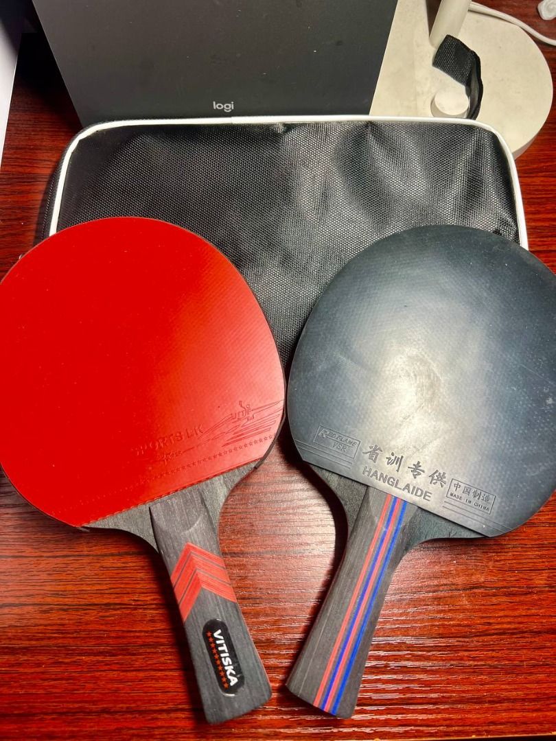 Table Tennis Racket SET OF 2 (Category: Racket and Ball Sports) located in Baguio. Submitted by carlbenta (Listing ID 1444241426, Image 1). Description: - VITISKA table tennis racket - Features a black and red handle with VITISKA logo and stars - Comes with a black protective bag - Perfect for playing table tennis - Ready for a new owner -Like new Location: Baguio City Shipping: J&T/FLASH/LBC .