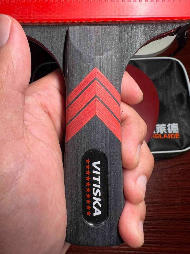 Table Tennis Racket SET OF 2 (Category: Racket and Ball Sports) located in Baguio. Submitted by carlbenta (Listing ID 1444241426, Image 2). Description: - VITISKA table tennis racket - Features a black and red handle with VITISKA logo and stars - Comes with a black protective bag - Perfect for playing table tennis - Ready for a new owner -Like new Location: Baguio City Shipping: J&T/FLASH/LBC .
