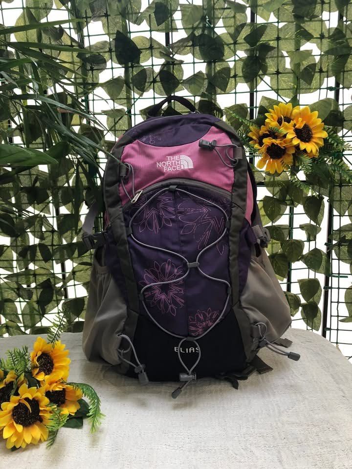 The North Face Backpack Purple Pink Floral (Category: Backpacks) located in Davao. Submitted by 4mscllection (Listing ID 1444177532, Image 1). Description: - Brand: The North Face - Color: Purple and Pink - Design: Floral - Features: Multiple pockets, adjustable straps - Capacity: Plenty of space inside - Ideal for: School, hiking.