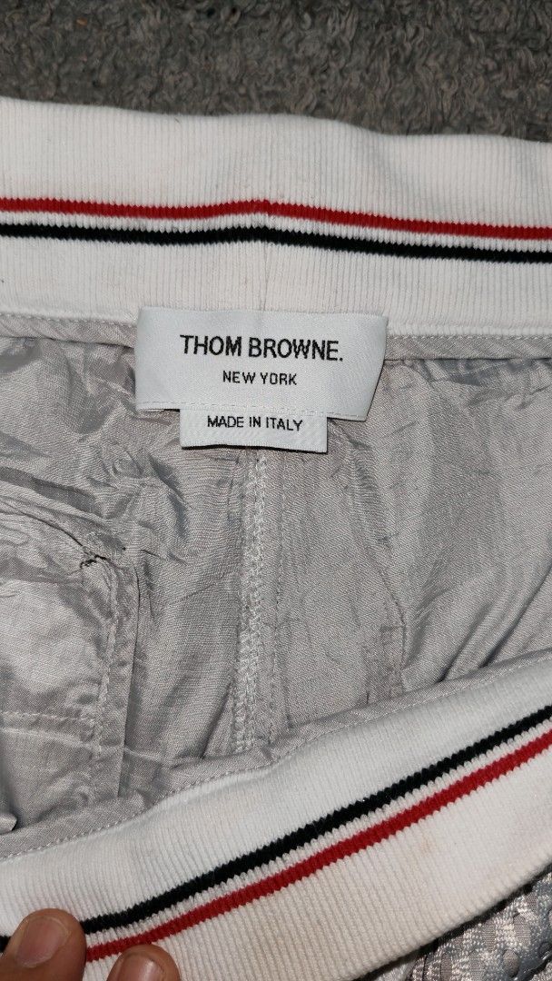 Thom Browne Mesh Shorts with 4-Bar Stripe (Category: Luxury Apparel) located in Cotabato. Submitted by rayhan.thriftee (Listing ID 1444263249, Image 3). Description: - Authentic Thom Browne Grey Mesh Shorts - Signature 4-Bar Stripe Detail on Side - Elastic Waistband with Drawstring - Made in Italy - Ideal for Casual Wear or Lounging.