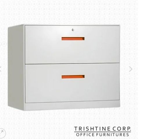 TLC-013 | 2-Drawer Lateral Filing Cabinet (Category: Office Furniture & Fixtures) located in Caloocan City. Submitted by jimtapitan_trishtinecorp. (Listing ID 1444134029, Image 1). Description: - Trishtine Corp. 2-drawer metal filing cabinet - Sleek grey finish with bright orange drawer pulls - Top drawer includes a lock for security - Sturdy construction for durability - Perfect for organizing your office space DISCLAIMER: PRICE IS FOR POSTING P
