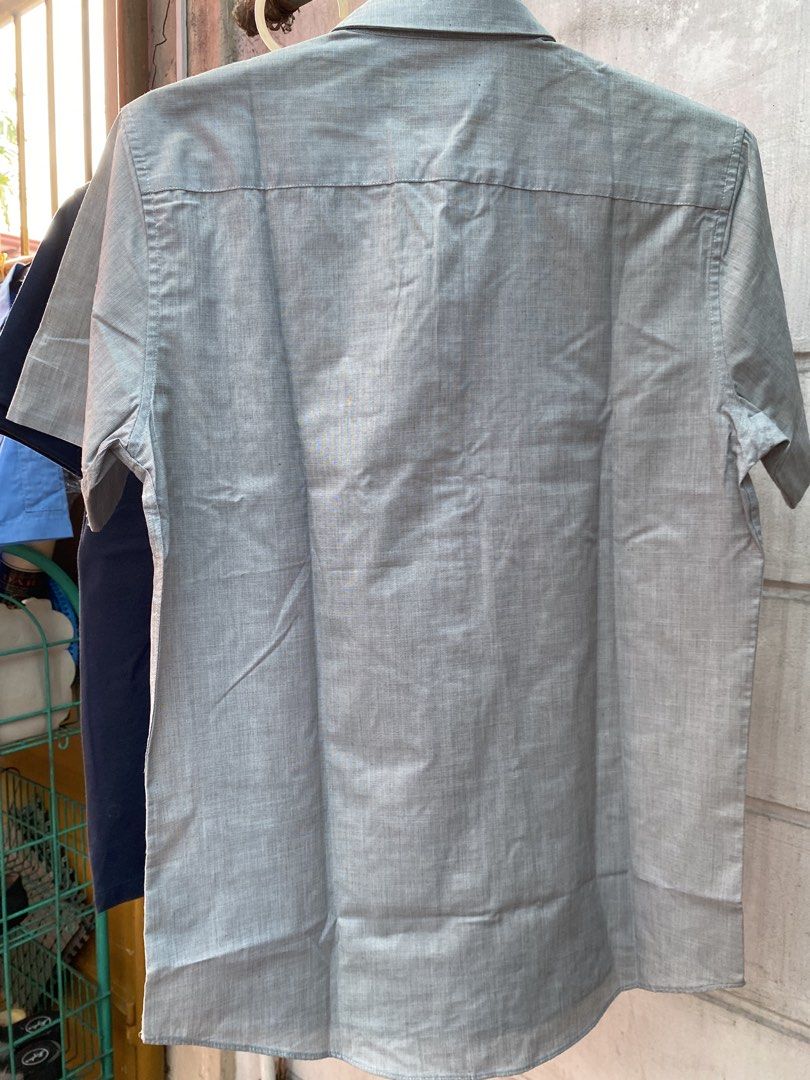 TOPMAN Grey Short Sleeve Button Up Shirt Size S (Category: Tshirts & Polo Shirts ) located in Quezon City. Submitted by maodg (Listing ID 1444249033, Image 3). Description: - Brand: TOPMAN - Color: Grey - Style: Short sleeve, button-up shirt - Features: Chest pocket - Origin: Made in Bangladesh - Size: S - Chest Fit: 36-38 inches - Occasion: Casual or smart casual wear - Condition: Please check photos for details Location: Scout area in Kamuning 