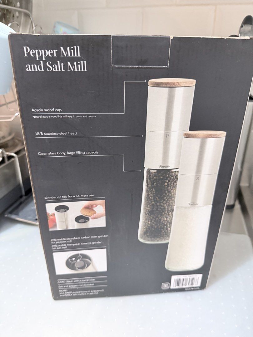 Trudeau ProChef Pepper Mill & Salt Mill Set (Category: Cookware & Accessories) located in Manila. Submitted by prelovedbymycam (Listing ID 1444211165, Image 2). Description: - Trudeau ProChef Pepper & Salt Mill Set - Elegant acacia wood caps - Durable 18/8 stainless-steel heads - Clear glass bodies with large capacity - Convenient top grinder for mess-free use - Adjustable ceramic grinder for salt - Sharp carbon steel grinder for pepper.