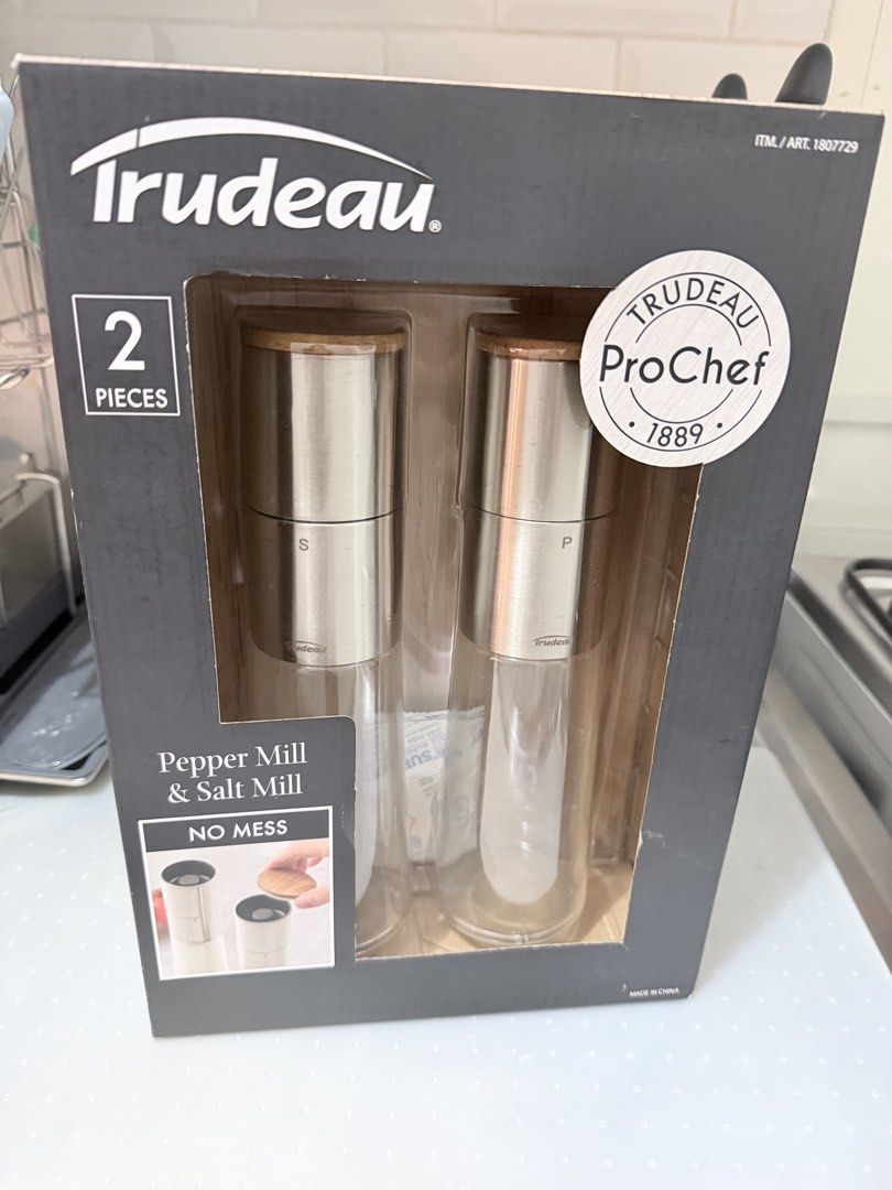Trudeau ProChef Pepper Mill & Salt Mill Set (Category: Cookware & Accessories) located in Manila. Submitted by prelovedbymycam (Listing ID 1444211165, Image 1). Description: - Trudeau ProChef Pepper & Salt Mill Set - Elegant acacia wood caps - Durable 18/8 stainless-steel heads - Clear glass bodies with large capacity - Convenient top grinder for mess-free use - Adjustable ceramic grinder for salt - Sharp carbon steel grinder for pepper.