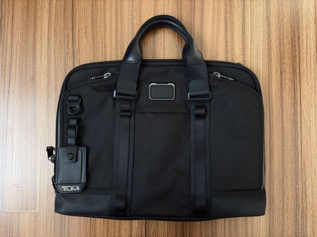 Tumi Academy Brief/Laptop Bag (Category: Briefcases) located in Caloocan City. Submitted by jacobkimbe52560 (Listing ID 1444152600, Image 1). Description: - Almost New Black Tumi Briefcase - Crafted from durable ballistic nylon - Features premium leather handles and trim - Multiple compartments for superior organization - Includes original luggage tag - Ideal for both professional work and travel needs RFS: Need funds. Condition: Still brand new 